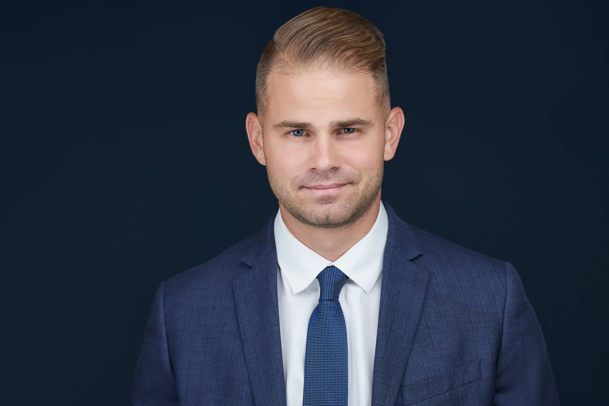 San Diego business owner headshot on dark backround