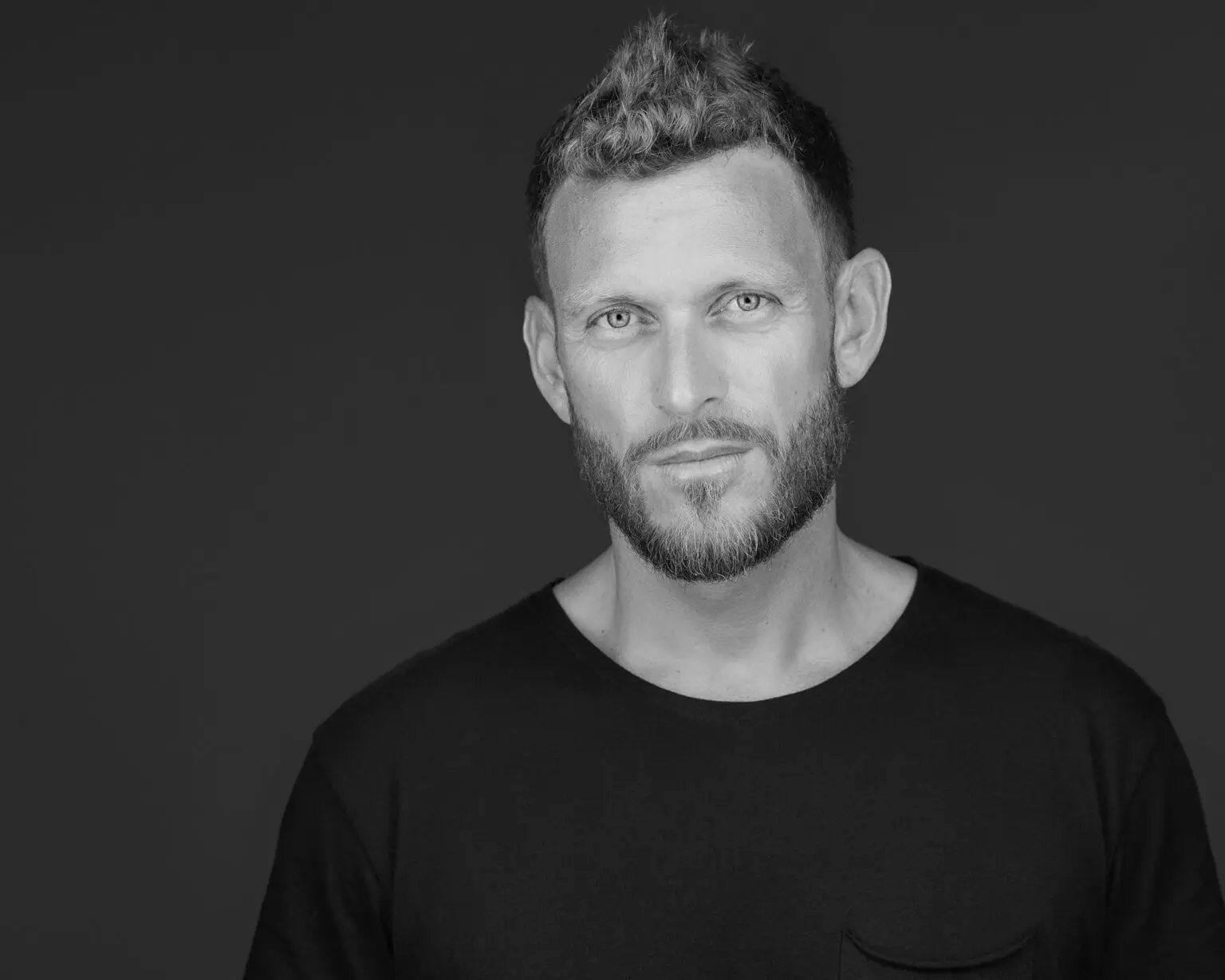 Professional headshot in black and white