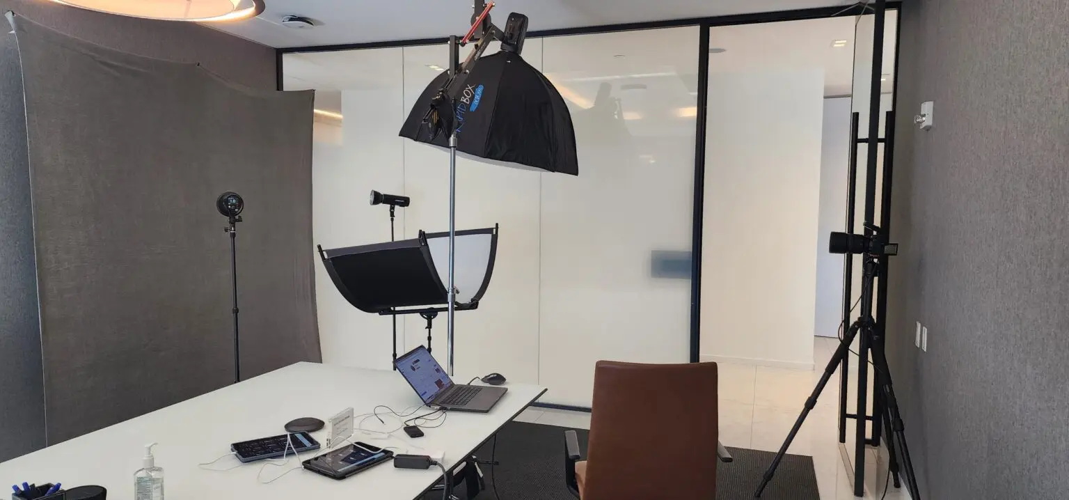 Professional headshots set up in a small conference room location