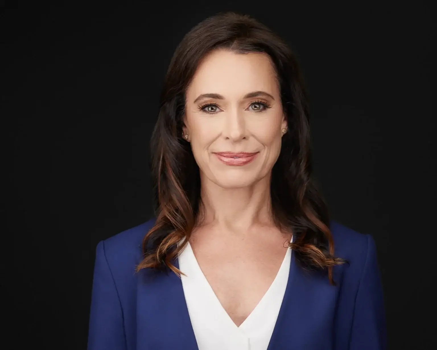 Business headshot on dark background