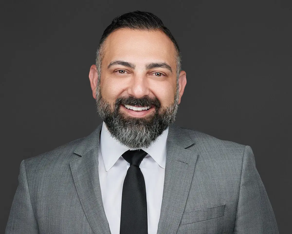 Sweet James lawyer headshot on dark background