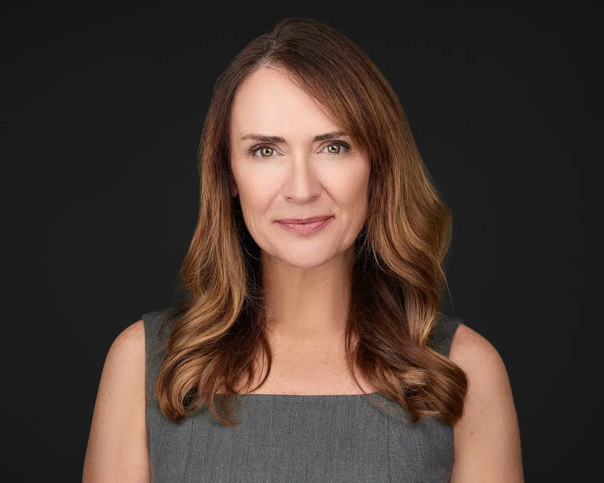 Business woman headshot wearing a dress