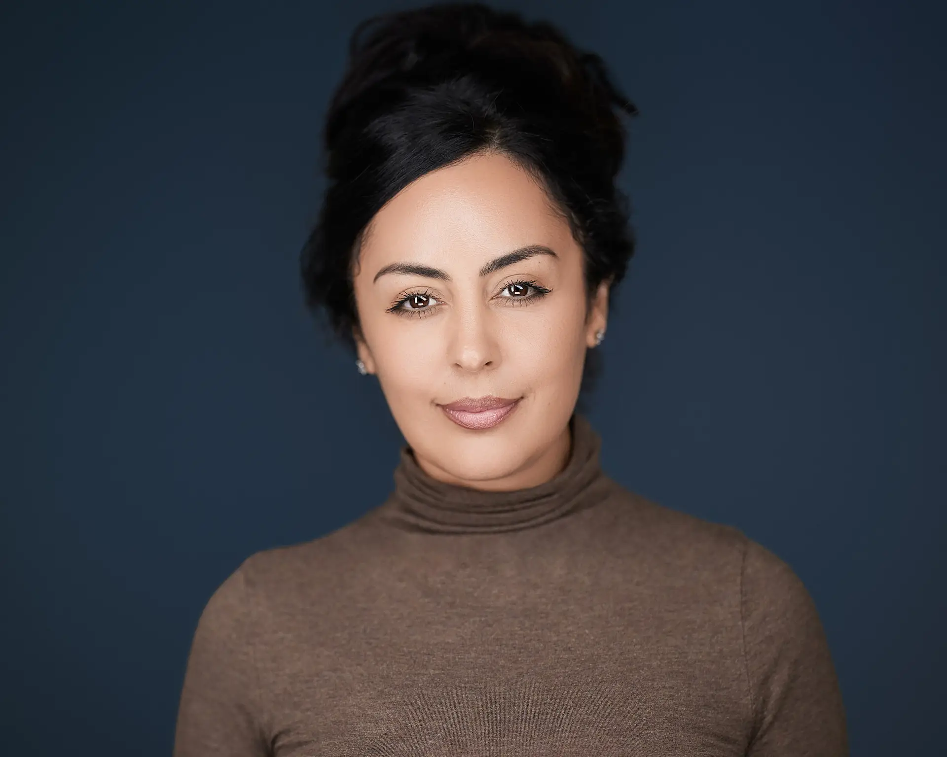 professional headshot in Orange County on blue background